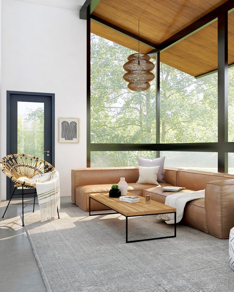 Light-filled mid-century modern Ottawa living room with warm wood ceiling, leather sectional and layered textures