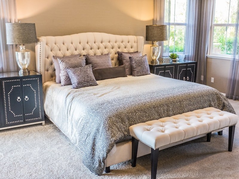 An elegant Ottawa bedroom with a tufted headboard, designed as a single-room project